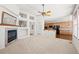 Spacious living room with fireplace, high ceilings, and built-in shelving at 958 Bramblewood Dr, Castle Pines, CO 80108