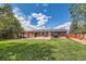 Expansive backyard with mature trees and covered patio, perfect for outdoor gatherings and relaxation at 2986 W Union Ave, Englewood, CO 80110