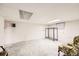 Spacious unfinished basement featuring tile flooring and large windows at 2986 W Union Ave, Englewood, CO 80110