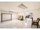 Unfinished basement with tile flooring, large window, and a peek into an adjacent space at 2986 W Union Ave, Englewood, CO 80110