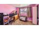 Bright bedroom featuring carpeted floors, natural lighting, and neutral decor at 2986 W Union Ave, Englewood, CO 80110