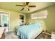 Cozy bedroom with large window, ceiling fan, and carpeted floors at 2986 W Union Ave, Englewood, CO 80110