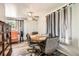 Bright dining area features modern ceiling fan, wood floors, and large window for natural light at 2986 W Union Ave, Englewood, CO 80110