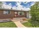 Inviting front porch area with red brick, leading to a modern home with nice landscaping at 2986 W Union Ave, Englewood, CO 80110