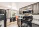 Well-maintained kitchen featuring stainless steel appliances, granite countertops, and modern appliances at 2986 W Union Ave, Englewood, CO 80110