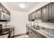 Well-maintained kitchen featuring stainless steel appliances, granite countertops, and ample cabinet space at 2986 W Union Ave, Englewood, CO 80110
