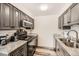 Well-maintained kitchen featuring stainless steel appliances, granite countertops, and ample cabinet space at 2986 W Union Ave, Englewood, CO 80110