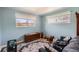 Comfortable living room with large windows providing natural light, and patterned rug at 2986 W Union Ave, Englewood, CO 80110