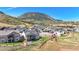 Aerial view of community highlighting homes nestled in the foothills with sprawling views of the surrounding mountains at 15773 Timber Trek Way, Monument, CO 80132