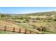 Scenic backyard featuring a hillside and wooden fence to set property lines and add a touch of nature at 15773 Timber Trek Way, Monument, CO 80132