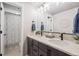 Bathroom featuring double sinks, modern fixtures, and a shower and bathtub at 15773 Timber Trek Way, Monument, CO 80132