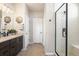 Modern bathroom featuring a glass-enclosed shower, stylish vanity, and neutral color scheme at 15773 Timber Trek Way, Monument, CO 80132