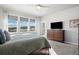 Bright, modern bedroom featuring scenic views through large windows and nice dresser at 15773 Timber Trek Way, Monument, CO 80132