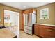 Modern kitchen featuring stainless steel refrigerator, granite countertops, and abundant cabinet space for storage at 12030 W Alameda Pkwy, Lakewood, CO 80228