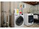 Bright laundry room featuring modern washer and dryer, ready for your daily needs at 12030 W Alameda Pkwy, Lakewood, CO 80228