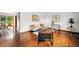 Bright living room with hardwood floors, modern furnishings, and large windows offering abundant natural light at 12030 W Alameda Pkwy, Lakewood, CO 80228