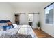 Main bedroom with ensuite bathroom and sliding barn doors at 1248 Perry St, Denver, CO 80204