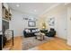 Bright living room with hardwood floors and a large rug at 1248 Perry St, Denver, CO 80204