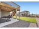 View of the backyard with an outdoor patio and stairs leading to the upper deck at 26731 E Hinsdale Pl, Aurora, CO 80016