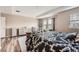 A spacious bedroom featuring wood floors, tray ceiling, neutral walls and walk-in closet at 26731 E Hinsdale Pl, Aurora, CO 80016