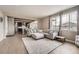 An open floor plan living room showcasing the connection to the kitchen and dining area at 26731 E Hinsdale Pl, Aurora, CO 80016