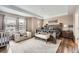A bright and inviting main bedroom with tray ceiling, wood floor and natural light at 26731 E Hinsdale Pl, Aurora, CO 80016