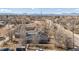 Vast aerial shot of a residential neighborhood with mountains visible in the distance, emphasizing scenery at 901 S Osceola St, Denver, CO 80219