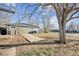 View of backyard with a small concrete pad, highlighting potential outdoor living and storage space at 901 S Osceola St, Denver, CO 80219