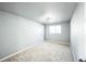 Neutral bedroom with plush carpet, updated ceiling fan, and natural light from window at 901 S Osceola St, Denver, CO 80219