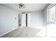 Neutral bedroom with plush carpet, updated ceiling fan and closet doors at 901 S Osceola St, Denver, CO 80219