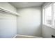 Neutral closet with plush carpet and window that allows in natural lighting at 901 S Osceola St, Denver, CO 80219