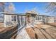 Charming single-story home with a covered front porch and a well-maintained yard at 901 S Osceola St, Denver, CO 80219