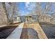 Single-story home with a simple but well-maintained landscape and a front walkway at 901 S Osceola St, Denver, CO 80219