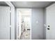 Hallway leading to water heater, with water storage and plumbing access at 901 S Osceola St, Denver, CO 80219