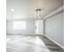 Bright living room featuring light laminate flooring and modern lighting at 901 S Osceola St, Denver, CO 80219