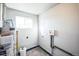 Storage area with water heater, plumbing connections, and space for storage at 901 S Osceola St, Denver, CO 80219