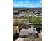Aerial view of neighborhood, showing the home, nearby shopping and Colorado mountains at 845 S Kenton St, Aurora, CO 80012