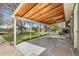 Spacious covered back patio with concrete foundation, view of shed and backyard at 845 S Kenton St, Aurora, CO 80012