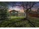 Well-maintained backyard with mature trees, perfect for outdoor entertaining and relaxation at 845 S Kenton St, Aurora, CO 80012