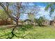A spacious backyard with mature trees and a charming storage shed at 845 S Kenton St, Aurora, CO 80012