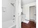 Bright bathroom featuring a modern shower and vanity, complemented by a hardwood floor at 845 S Kenton St, Aurora, CO 80012