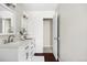 Well-lit bathroom featuring a double vanity with quartz countertops and modern design at 845 S Kenton St, Aurora, CO 80012