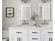 Close-up of bathroom double vanity with elegant mirrors and modern countertops at 845 S Kenton St, Aurora, CO 80012