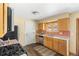 Functional kitchen with warm wood cabinets and stainless steel appliances at 845 S Kenton St, Aurora, CO 80012