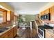 Open kitchen with a dining nook and sliding glass door leading to the backyard at 845 S Kenton St, Aurora, CO 80012
