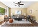 Stylish living room featuring hardwood floors, contemporary furnishings, and a bright, airy atmosphere at 845 S Kenton St, Aurora, CO 80012