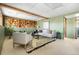Basement living room features built-in shelving, a sectional sofa, and modern decor at 845 S Kenton St, Aurora, CO 80012