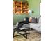 Close up of a cozy living room featuring a comfortable couch and unique bookshelf display at 845 S Kenton St, Aurora, CO 80012