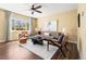 Cozy living room filled with natural light, featuring a large window and neutral color palette at 845 S Kenton St, Aurora, CO 80012