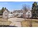 Aerial view of a large home with a circular driveway and well-maintained landscaping at 1 Random Rd, Englewood, CO 80113